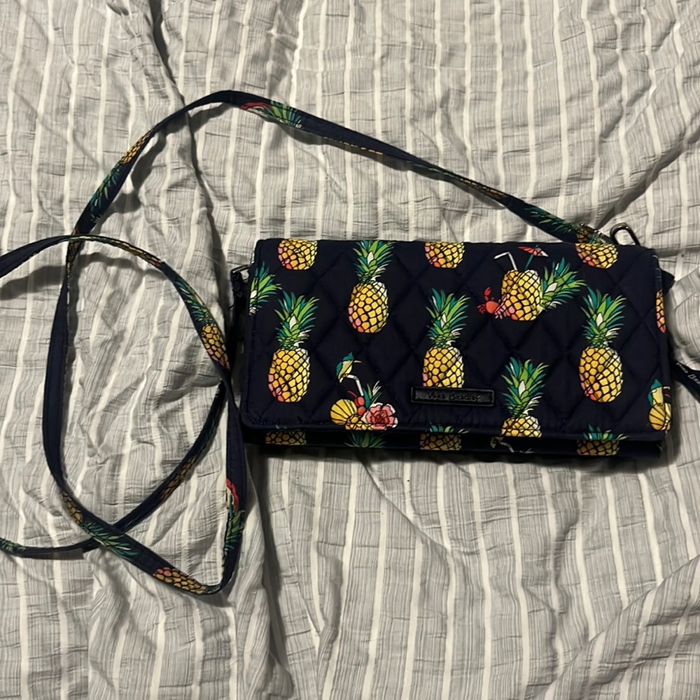 Vera Bradley small crossbody. Inside is a wallet.